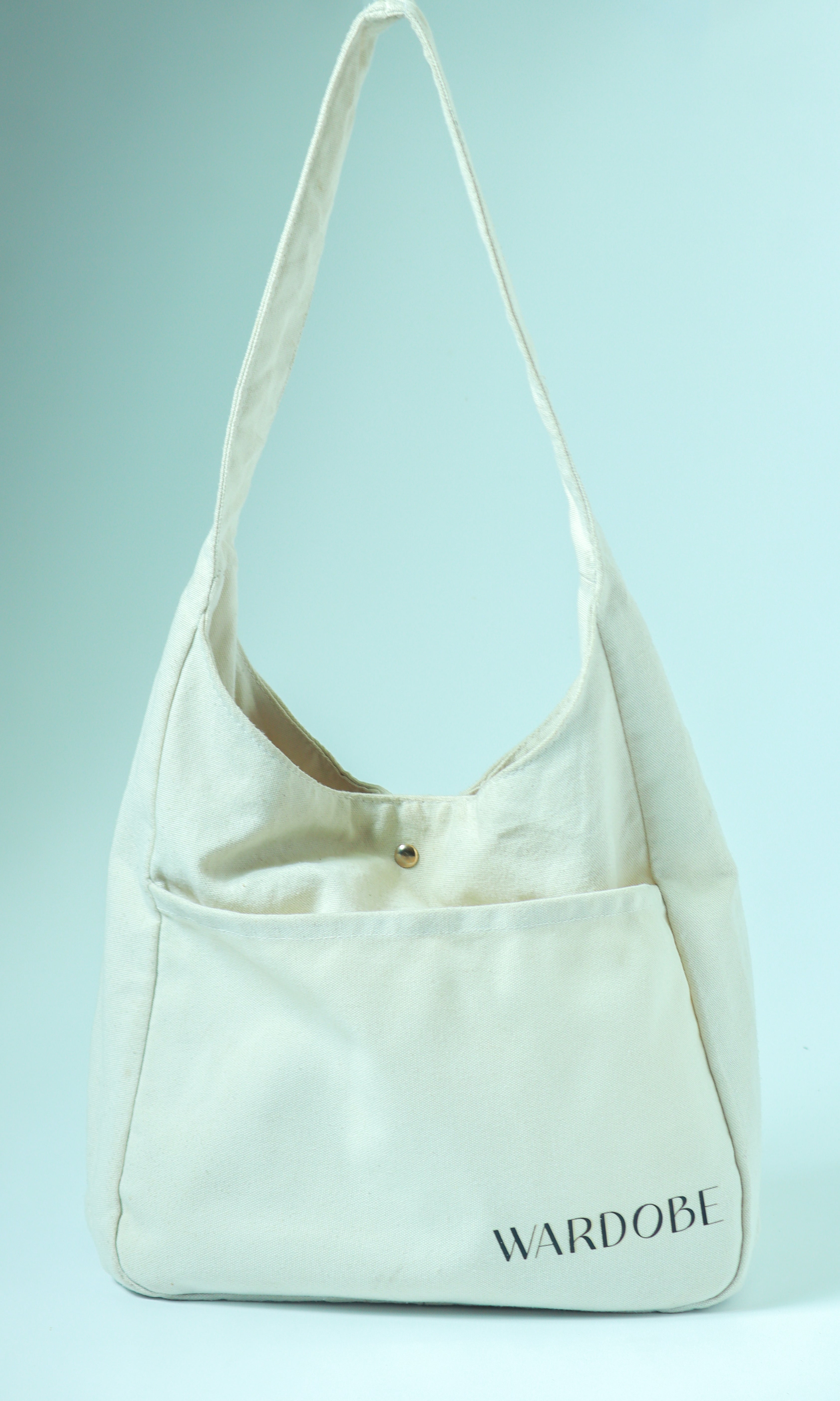 Front view of the off-white everyday essential tote bag.
​For the right-side view